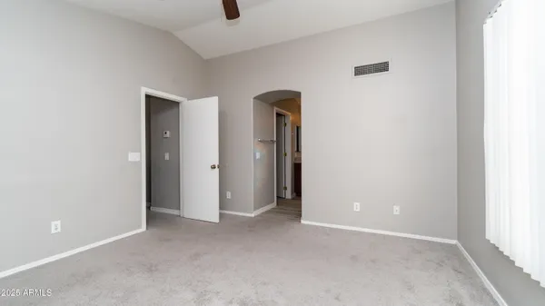 a view of an empty room with a window