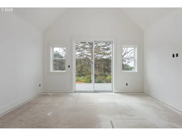a view of a room that has a large window