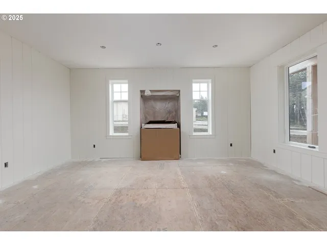 a view of a kitchen with an empty space and a window