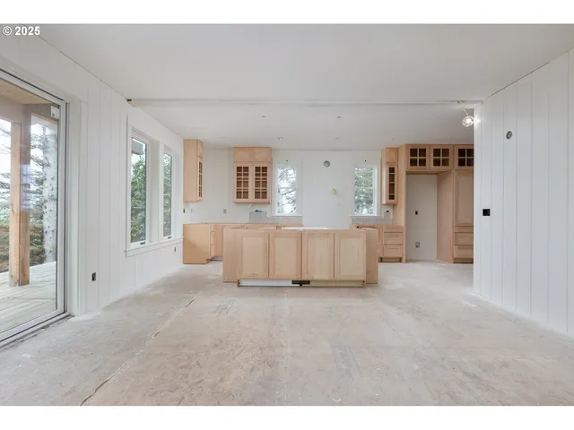 a view of a room with a closet and windows