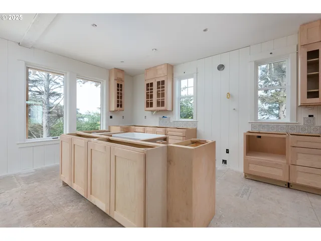 a spacious bathroom with sinks mirror and a bathtub