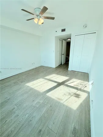 a view of a livingroom with a kitchen