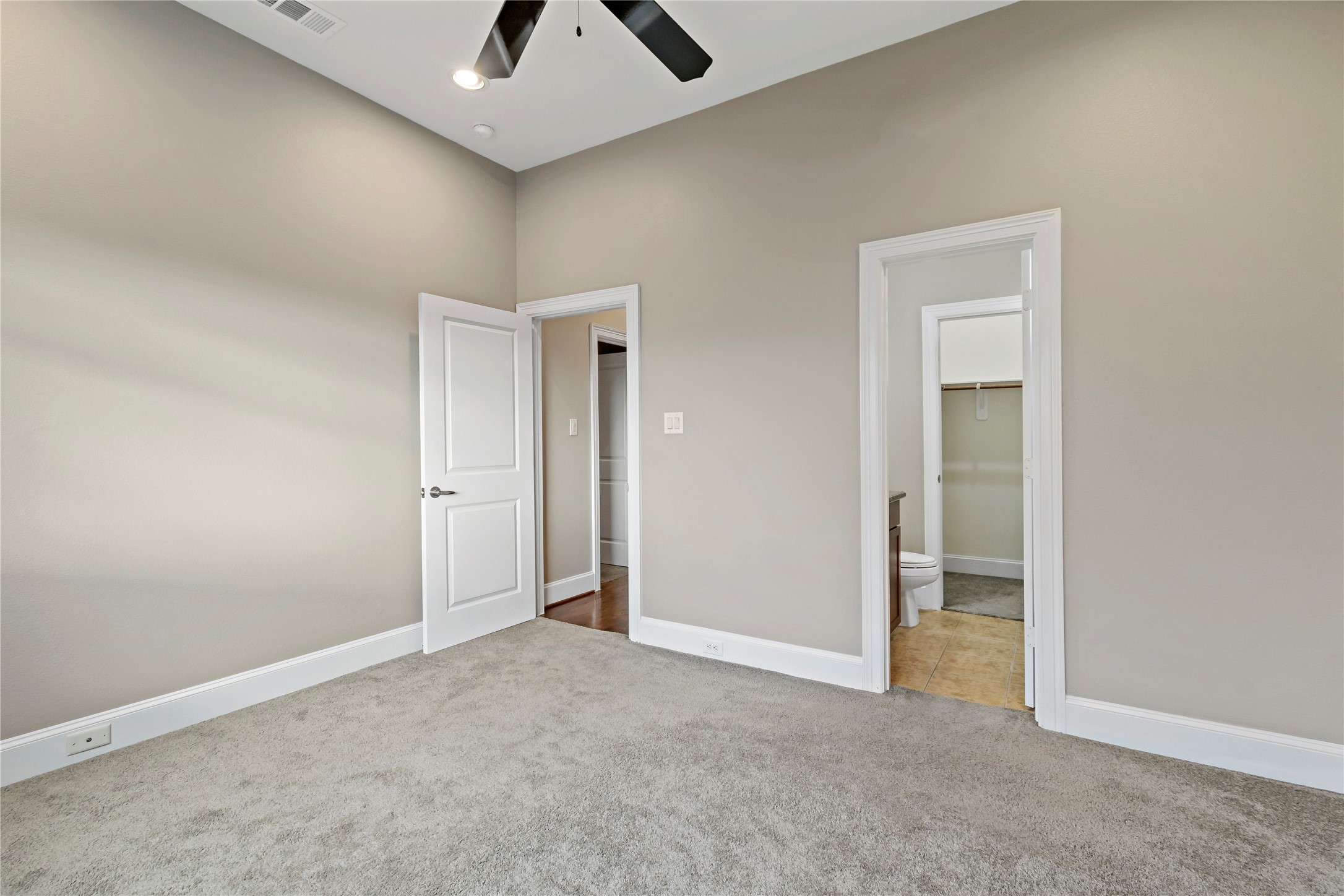 808 Paige Street Houston, TX 77003 - Photo 13 of 23 Discover tranquility in Primary Bedroom 3, featuring plush carpeting, a soothing color palette, and abundant natural light for a serene retreat.