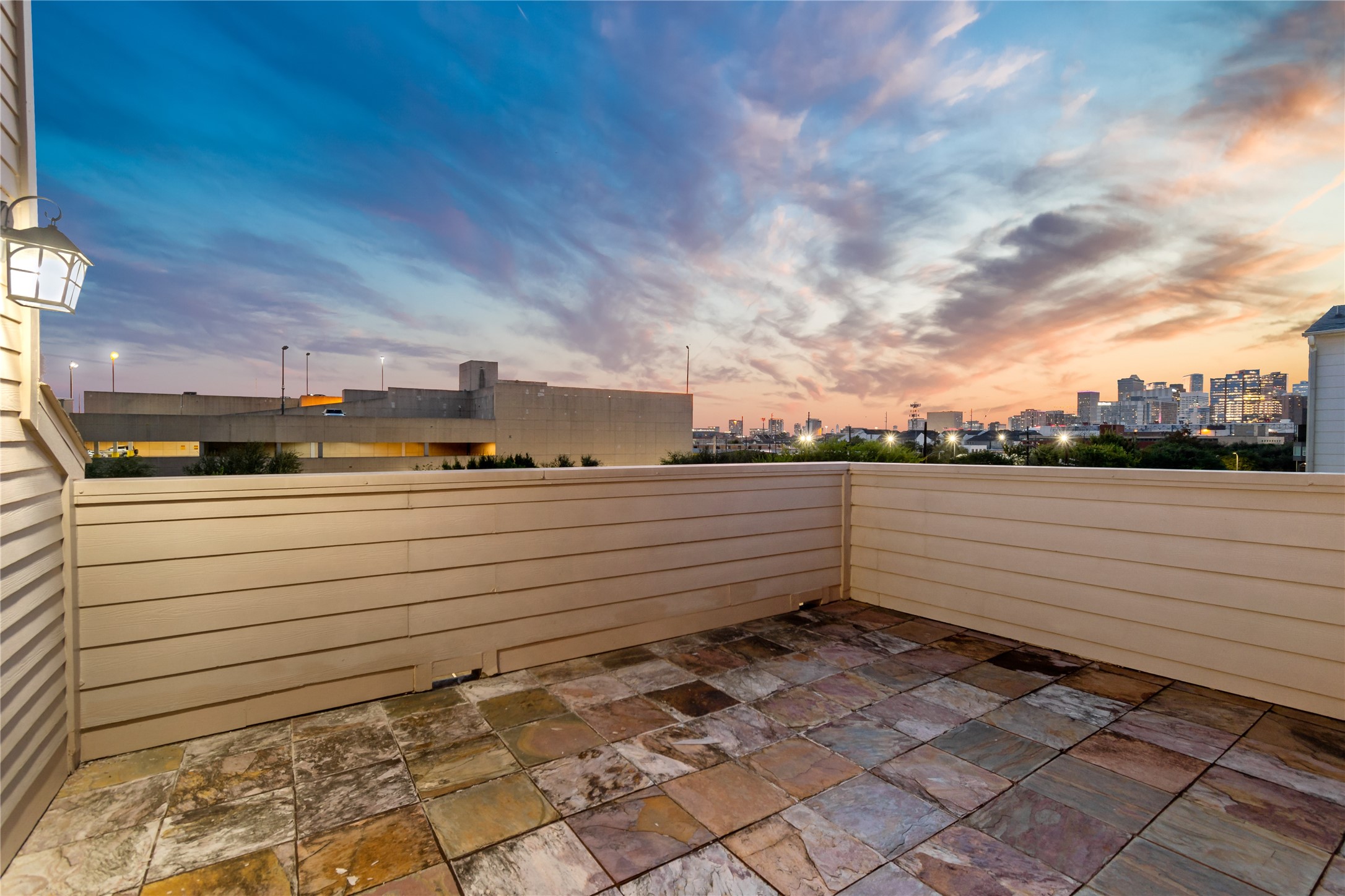 808 Paige Street Houston, TX 77003 - Photo 22 of 23 Experience breathtaking sunset views from your spacious rooftop balcony, offering a serene escape above the cityscape.