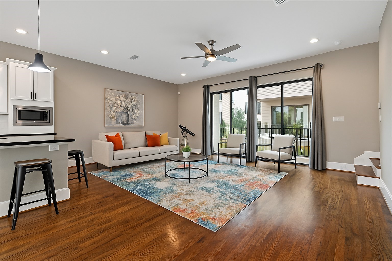 808 Paige Street Houston, TX 77003 - Photo 4 of 23 Experience seamless indoor-outdoor living in this spacious main area, featuring an inviting AI-designed furniture layout that opens onto a serene deck.