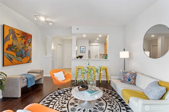 a living room with furniture and a potted plant