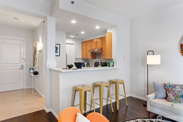 a kitchen with stainless steel appliances granite countertop a stove and a sink