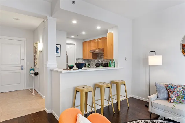 a kitchen with stainless steel appliances granite countertop a stove and a sink