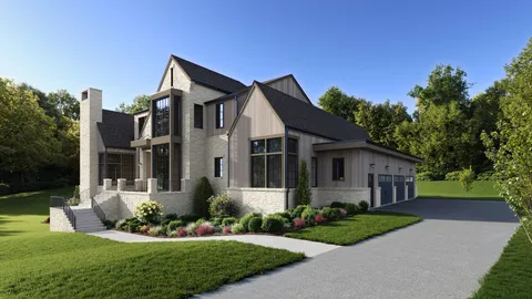 a front view of a house with a yard and potted plants