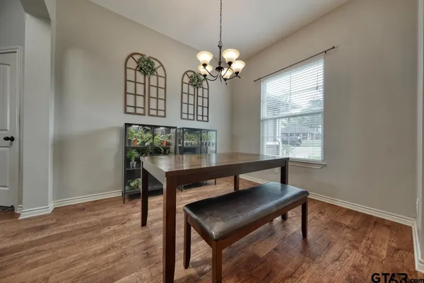 a view of a room with furniture window and wooden floor