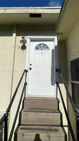 a view of a kitchen with a dishwasher and a stove top oven