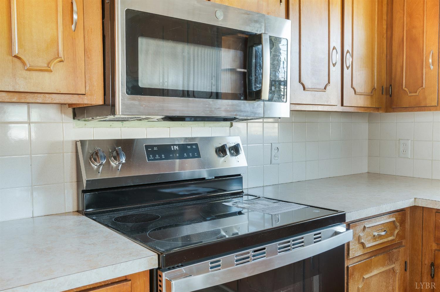492 Greendale Drive Rustburg, VA 24588 - Photo 9 of 39 a stove top oven sitting inside of a kitchen