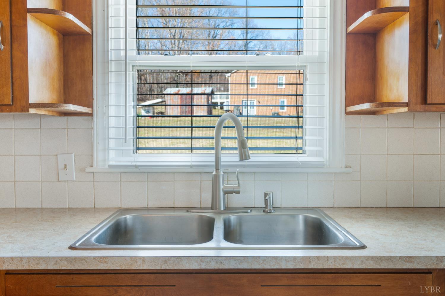 492 Greendale Drive Rustburg, VA 24588 - Photo 10 of 39 a kitchen sink with a granite countertop window