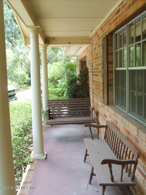 35119 Braddock Road Callahan, FL 32011 - Photo 2 of 19 Relax on the front porch swing