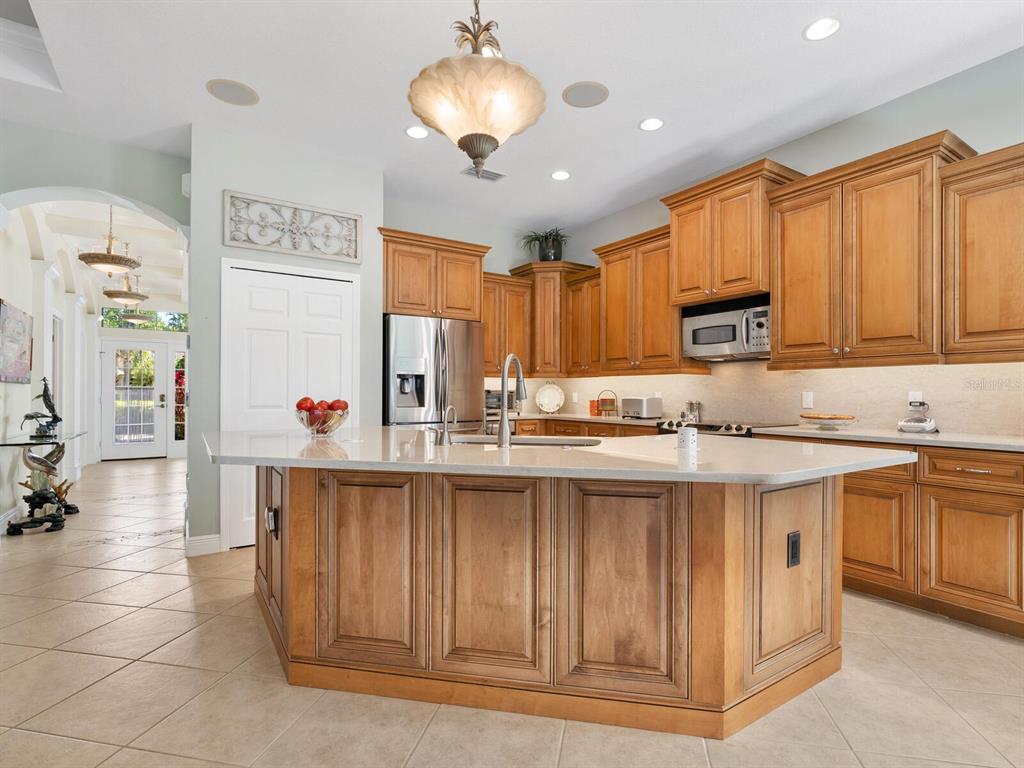 13911 Siena Loop Lakewood Ranch, FL 34202 - Photo 13 of 63 a kitchen with cabinets a sink and appliances