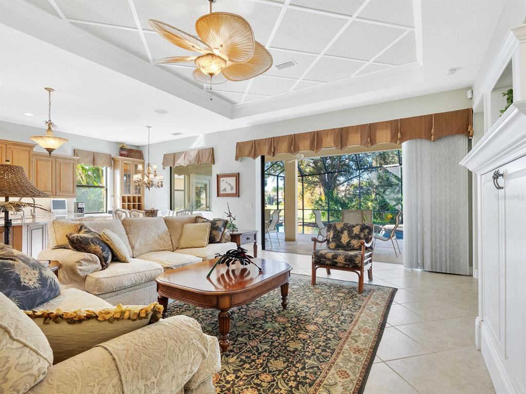 13911 Siena Loop Lakewood Ranch, FL 34202 - Photo 19 of 63 a living room with furniture and a large window
