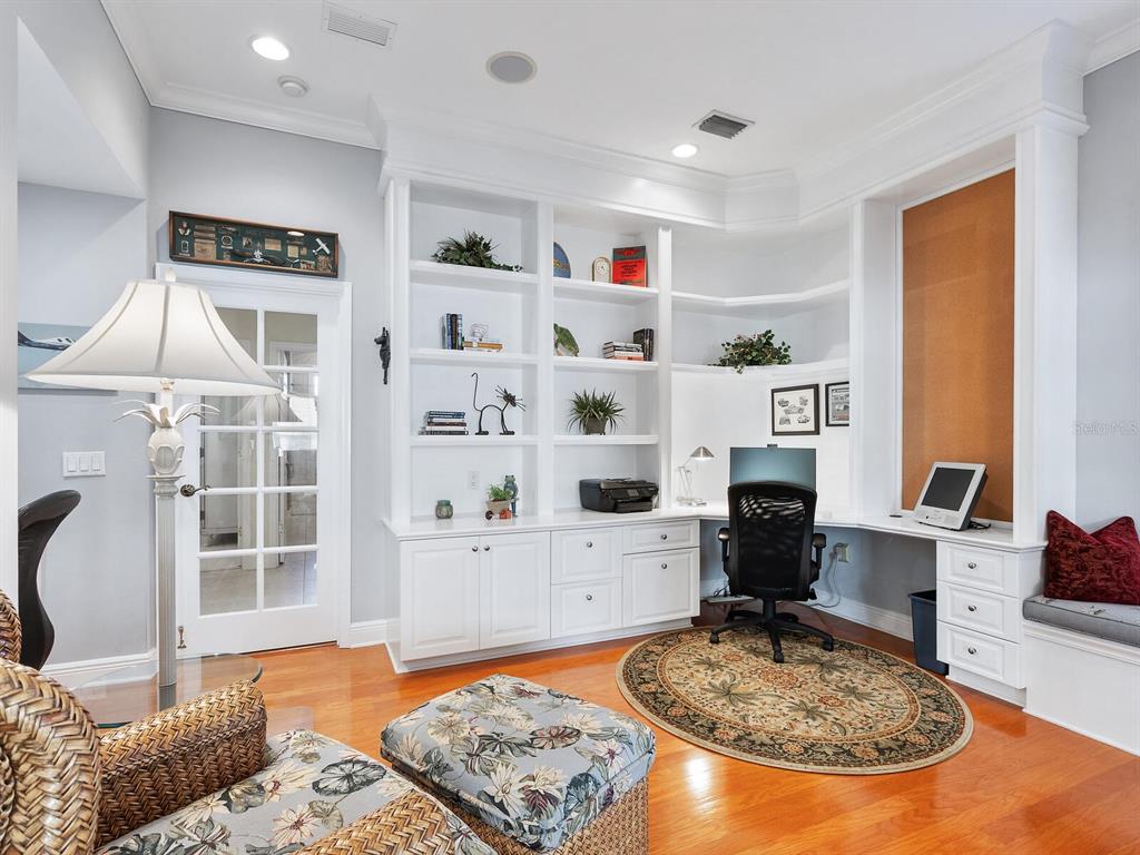 13911 Siena Loop Lakewood Ranch, FL 34202 - Photo 28 of 63 a living room with furniture a rug and a fireplace