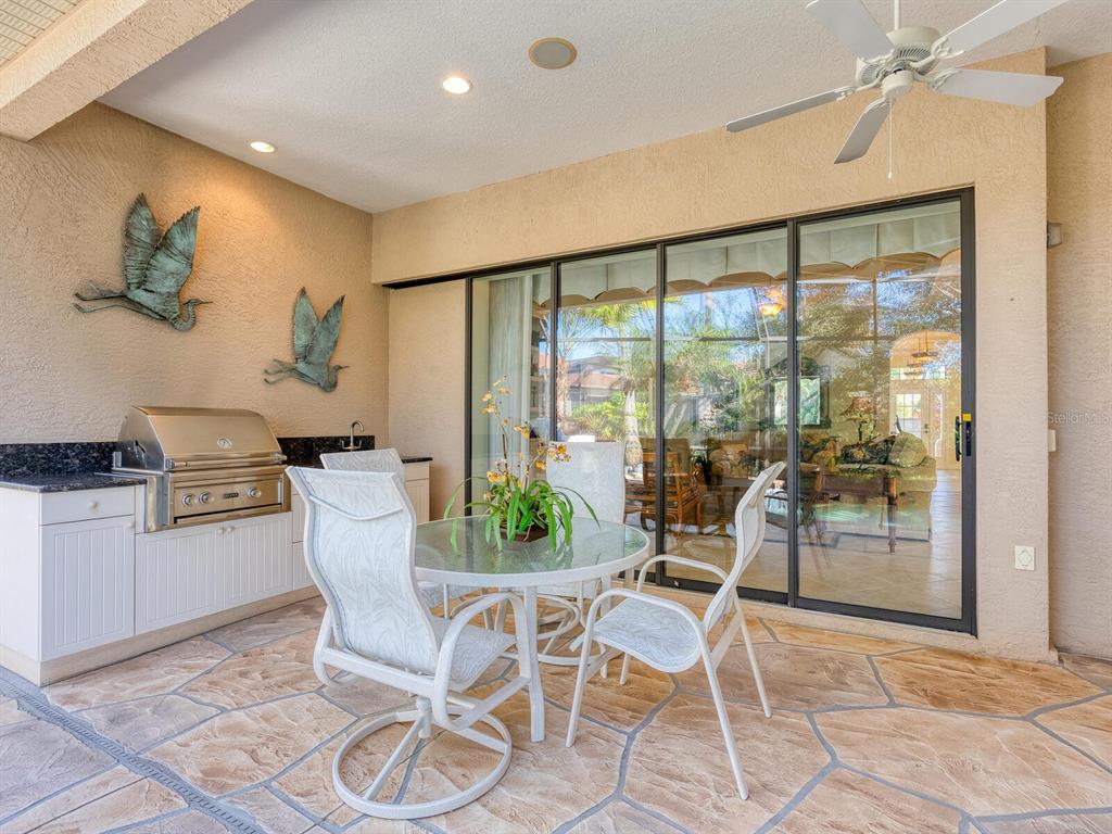 13911 Siena Loop Lakewood Ranch, FL 34202 - Photo 43 of 63 a dining room with furniture and window