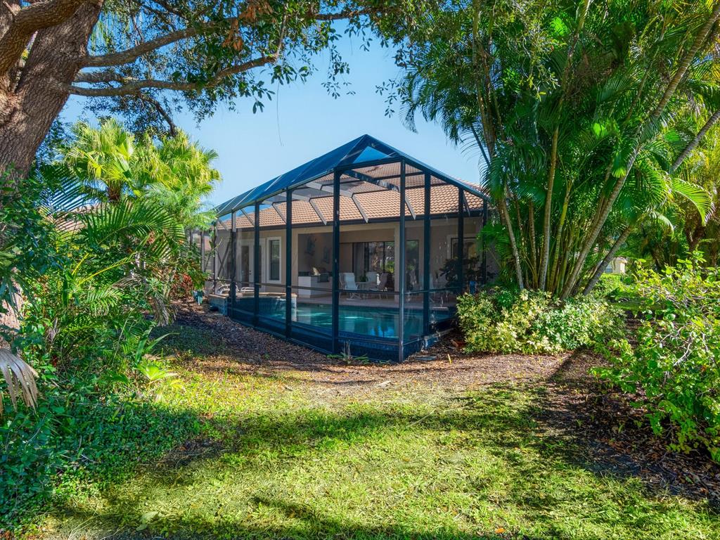 13911 Siena Loop Lakewood Ranch, FL 34202 - Photo 50 of 63 a view of a house with backyard and sitting area