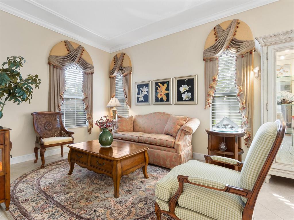 13911 Siena Loop Lakewood Ranch, FL 34202 - Photo 8 of 63 a living room with furniture and a large window
