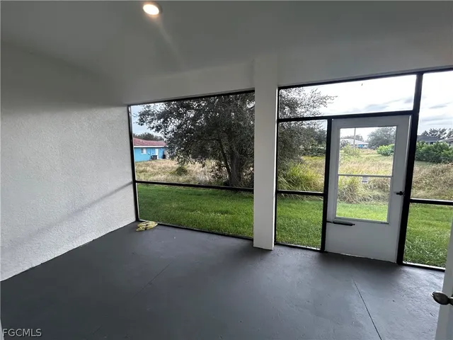 a view of a room with large windows