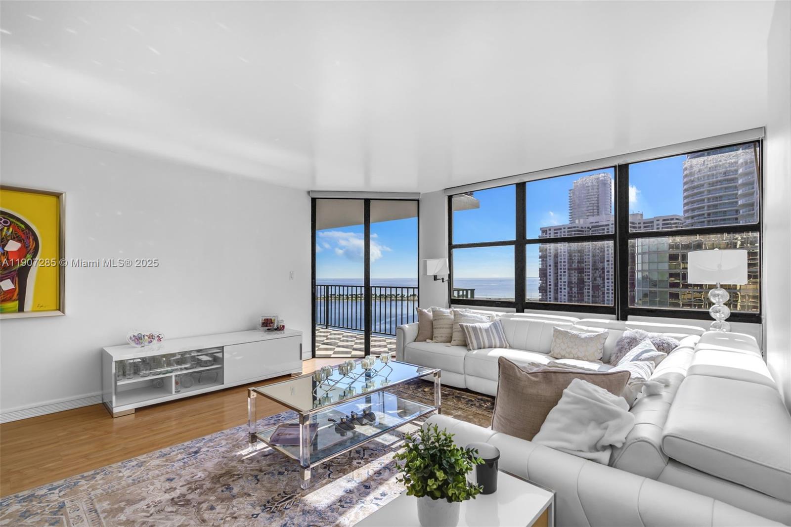 1925 Brickell Avenue, Unit 1811 Miami, FL 33129 - Photo 12 of 63 a living room with furniture and a floor to ceiling window