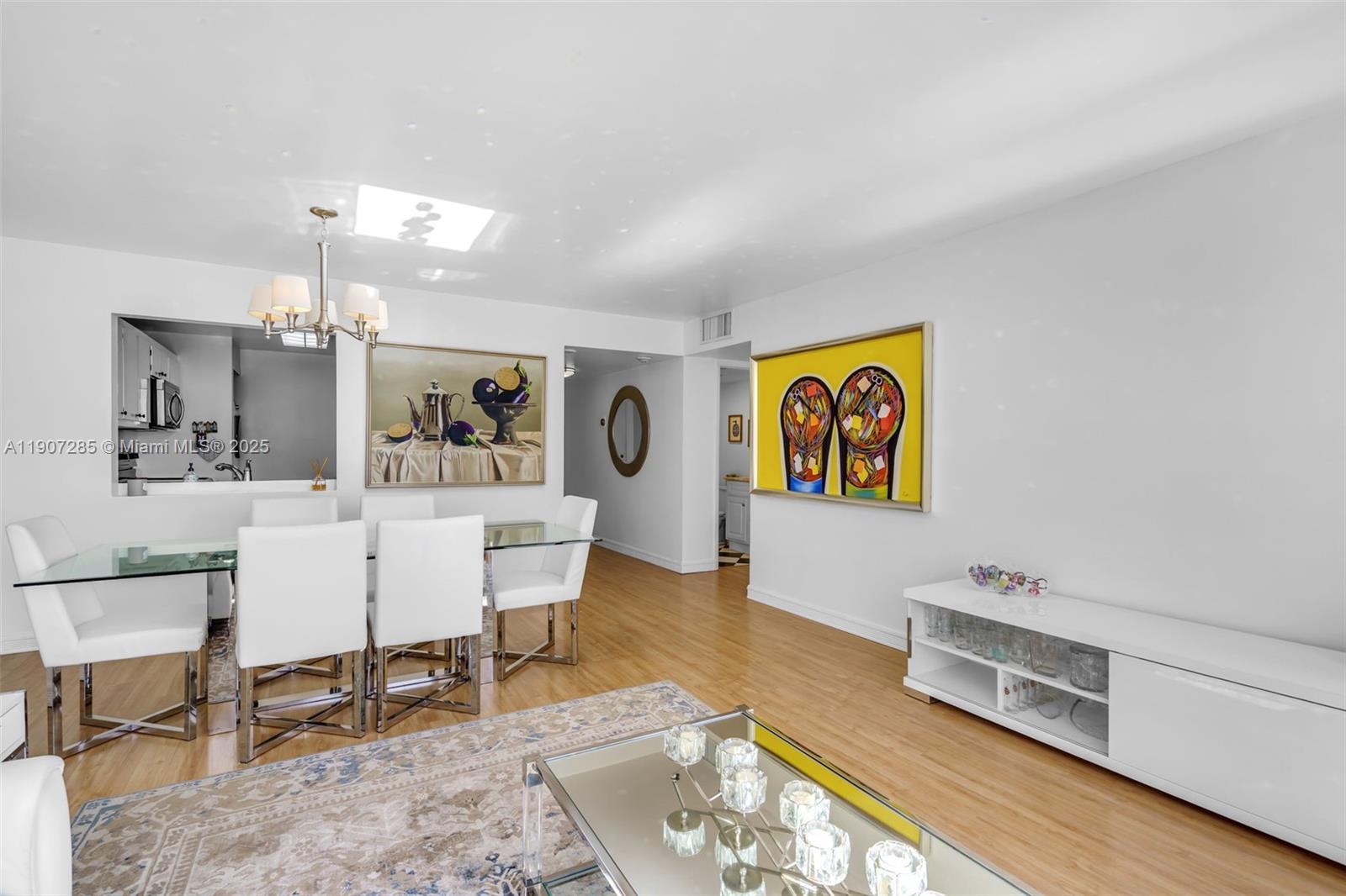 1925 Brickell Avenue, Unit 1811 Miami, FL 33129 - Photo 13 of 63 a living room with furniture and wooden floor