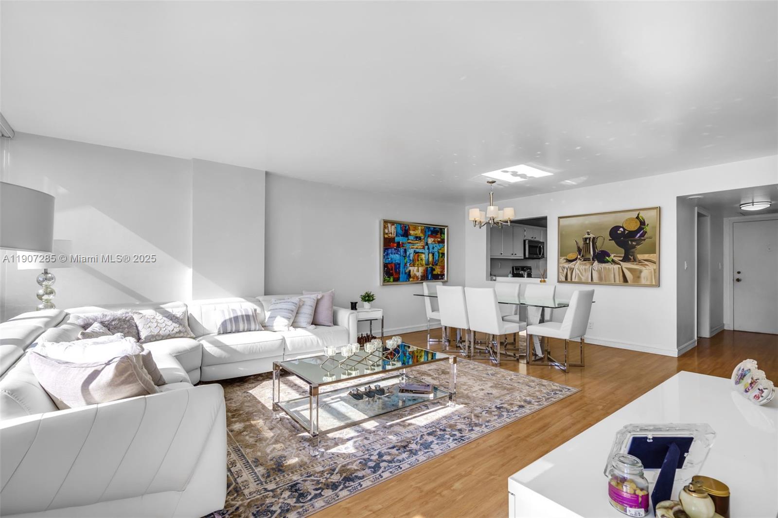 1925 Brickell Avenue, Unit 1811 Miami, FL 33129 - Photo 14 of 63 a living room with furniture and wooden floor