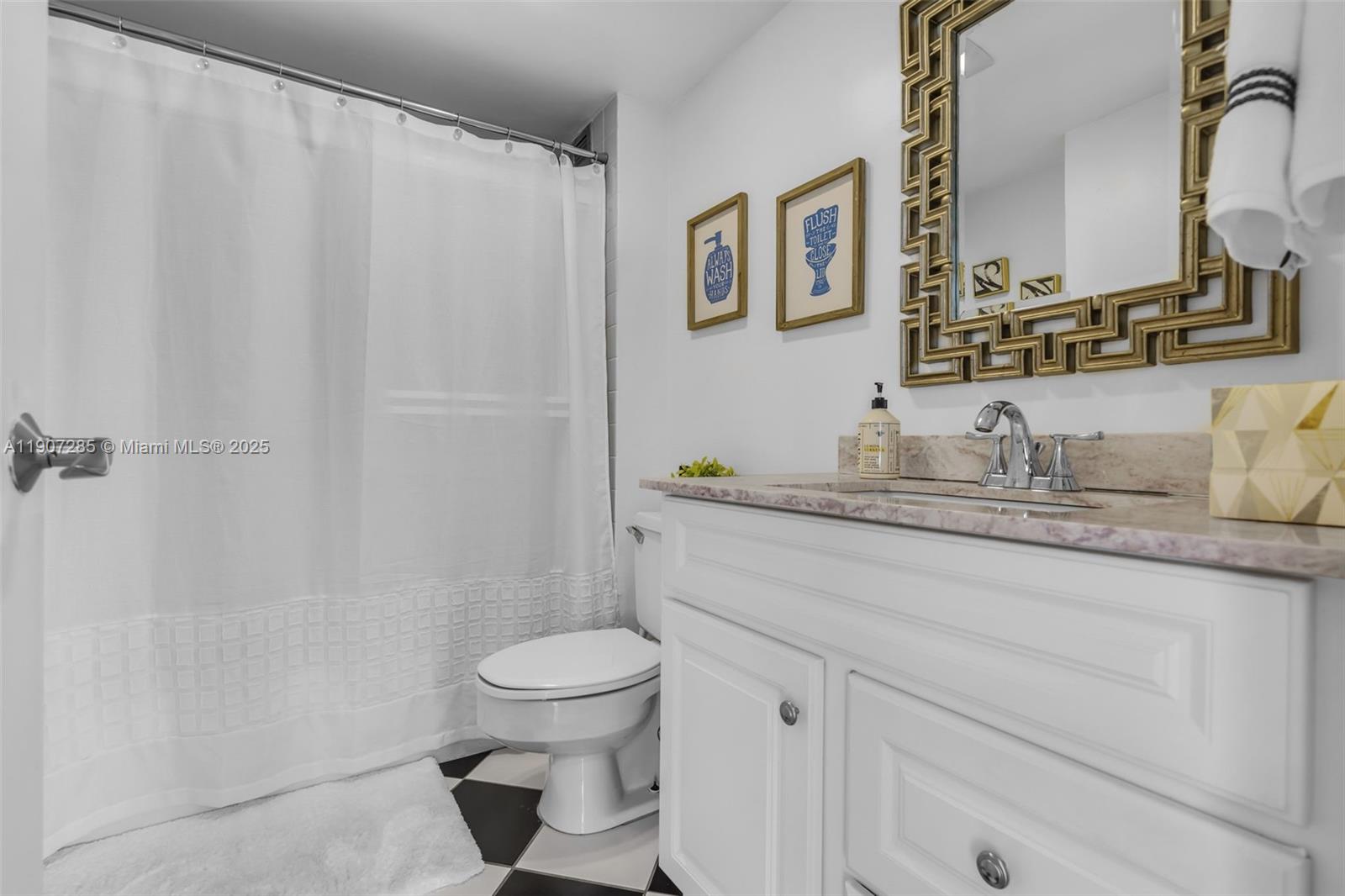 1925 Brickell Avenue, Unit 1811 Miami, FL 33129 - Photo 15 of 63 a bathroom with a granite countertop sink toilet and shower
