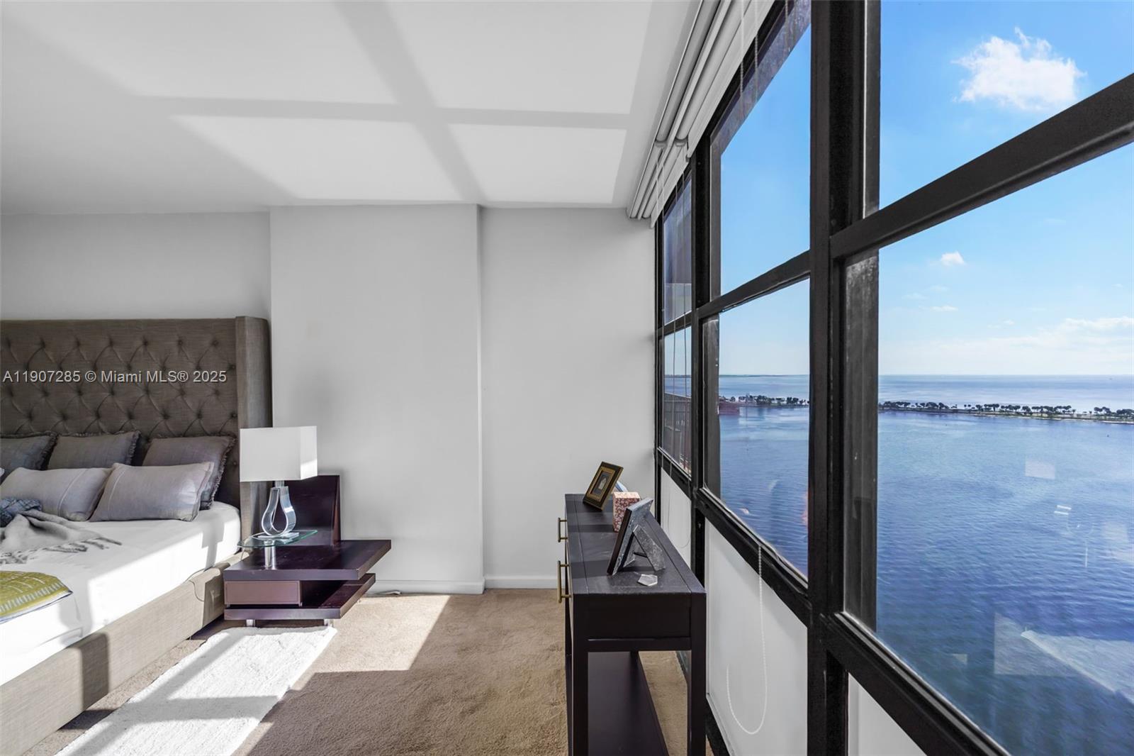 1925 Brickell Avenue, Unit 1811 Miami, FL 33129 - Photo 20 of 63 a living room with furniture and a floor to ceiling window
