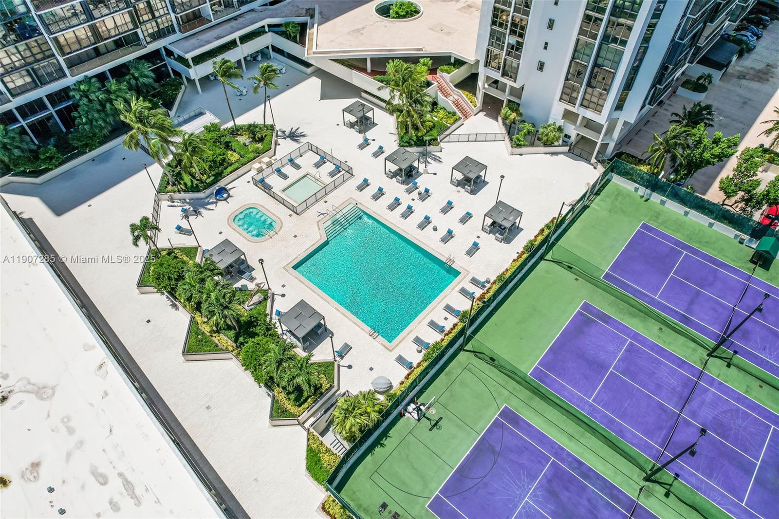 1925 Brickell Avenue, Unit 1811 Miami, FL 33129 - Photo 36 of 63 an aerial view of a tennis ground with a red umbrella