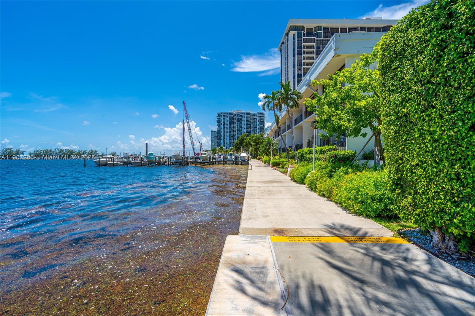1925 Brickell Avenue, Unit 1811 Miami, FL 33129 - Photo 41 of 63 a view of a swimming pool with an outdoor space and seating area