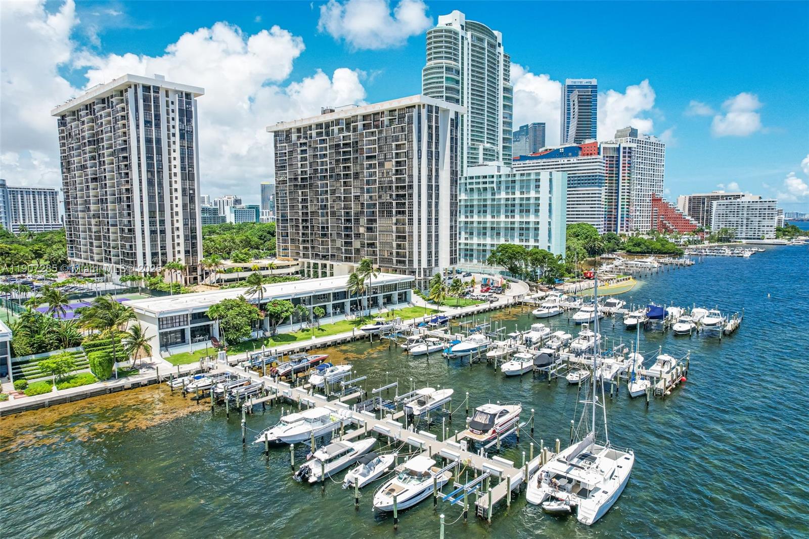 1925 Brickell Avenue, Unit 1811 Miami, FL 33129 - Photo 63 of 63 a large body of water with a building and trees in the background