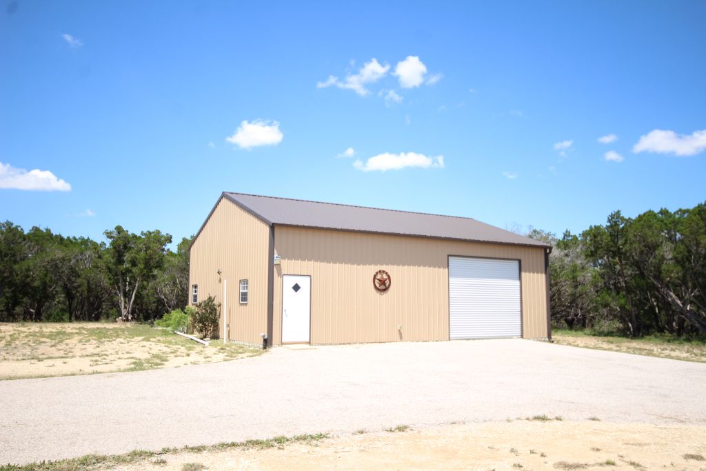 19920 Old Burnet Road Jonestown, TX 78645 - Photo 25 of 29 Detached 30 X 40 workshop and 1-bay garage has back patio set up for hot tub