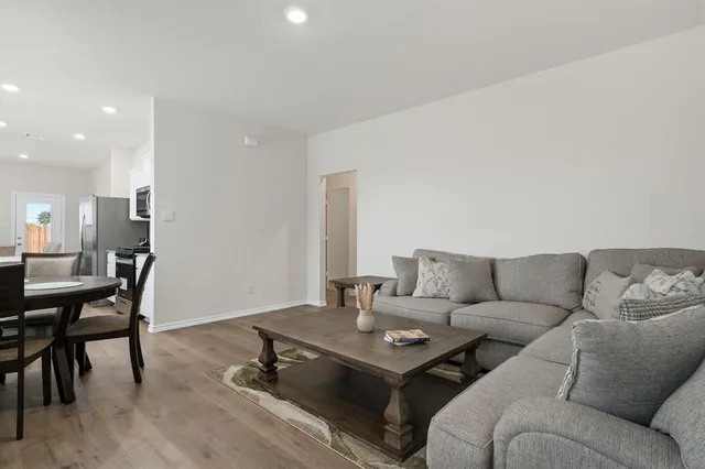 a living room with furniture and a table
