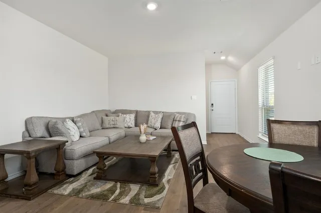 a living room with furniture and a table