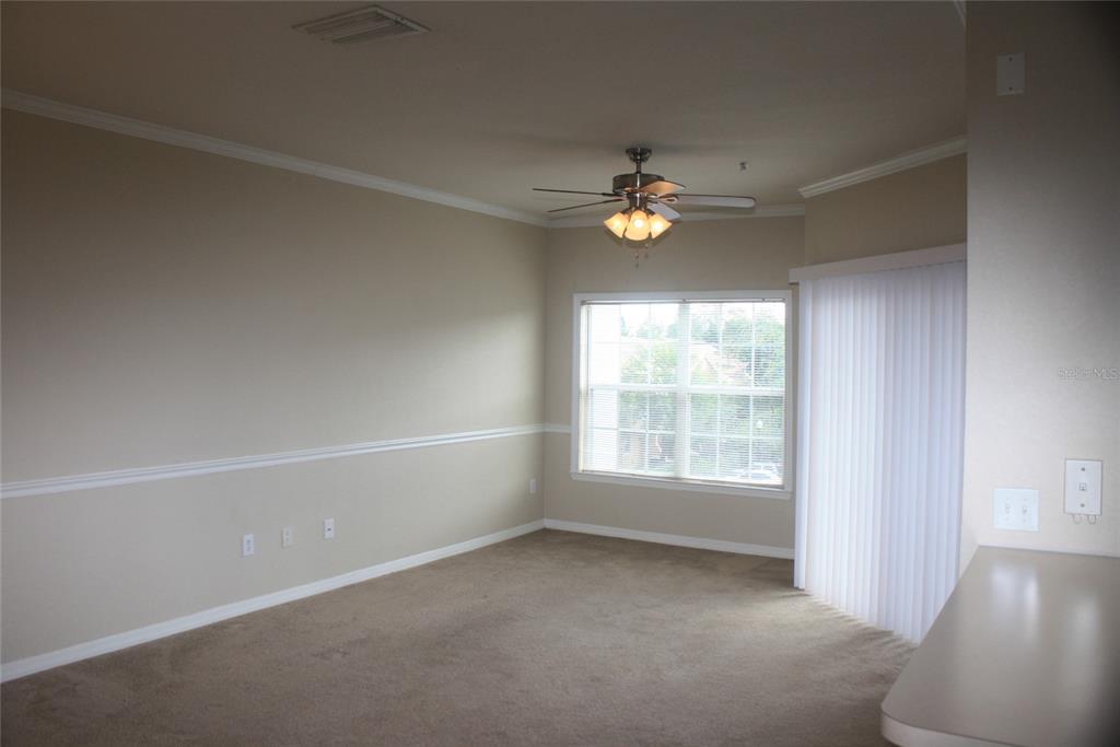 3621 Conroy Road, Unit 739 Orlando, FL 32839 - Photo 3 of 20 an empty room with a window