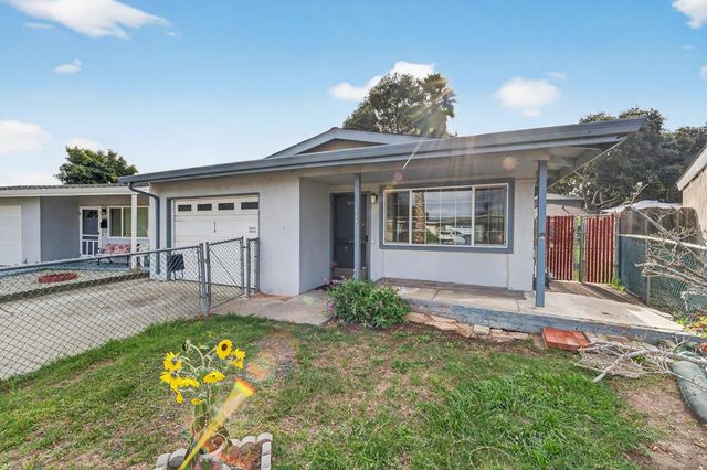 a view of a front of a house with a yard