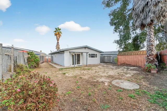 a house view with a backyard space