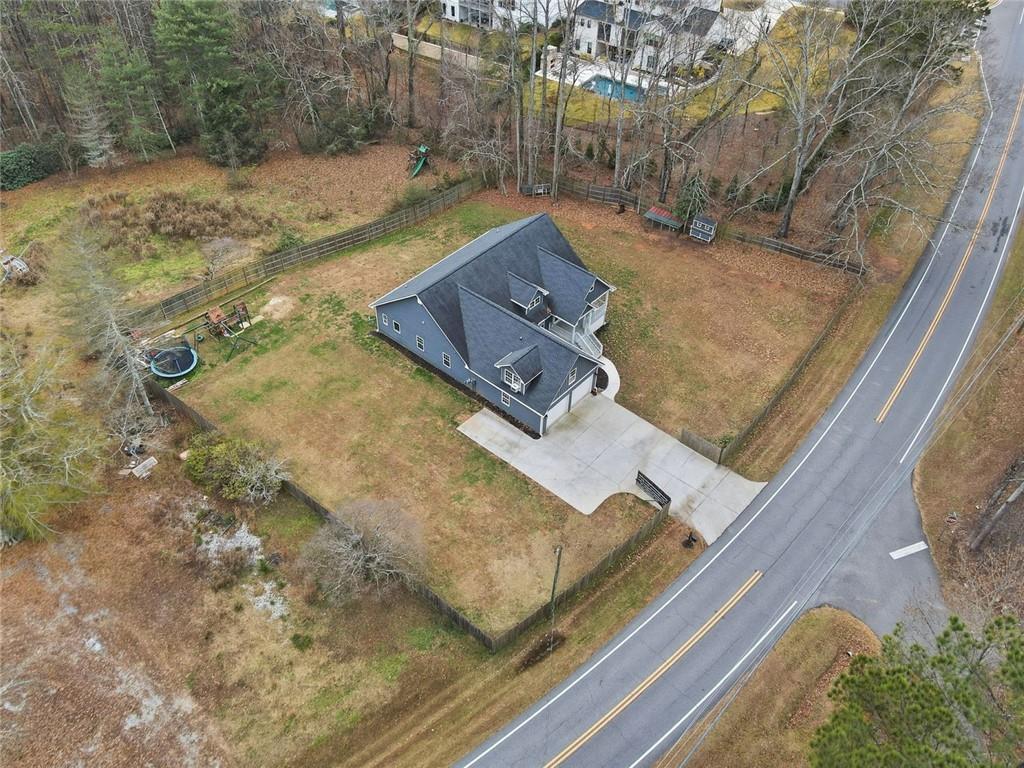1006 Owens Store Road Canton, GA 30115 - Photo 47 of 48 a view of a house with a yard