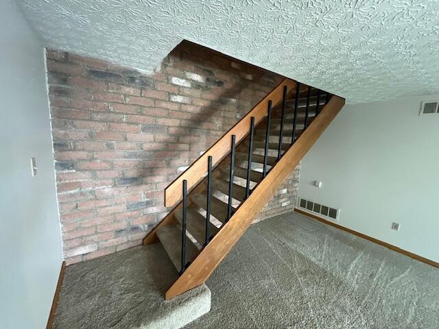 707 Cherry Hollow Road, Unit C Columbus, OH 43228 - Photo 10 of 21 Stylish open stair to second level with iron rails.