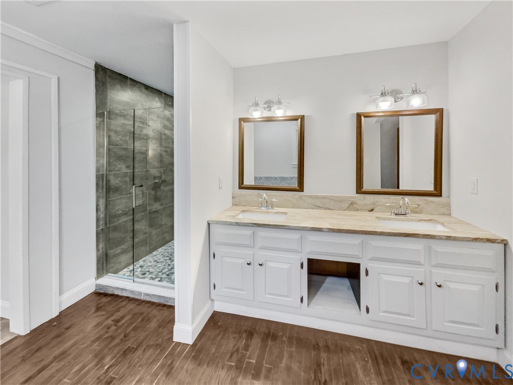 310 Burnwick Road Richmond, VA 23227 - Photo 20 of 21 a bathroom with a sink and a mirror