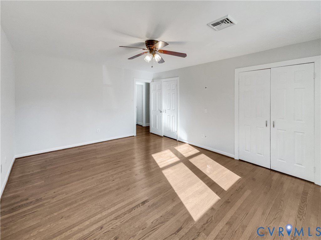 310 Burnwick Road Richmond, VA 23227 - Photo 4 of 21 wooden floor in an empty room with a window