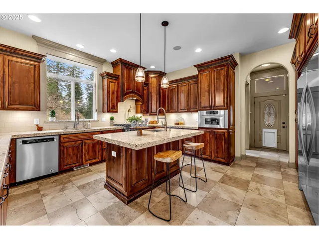 a utility room with sink dryer and washer