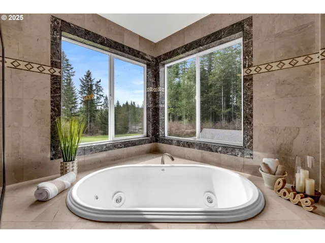 a large bathroom with a large tub and sink