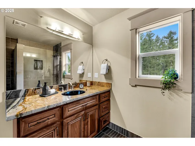 a view of a porch with wooden floor and fence