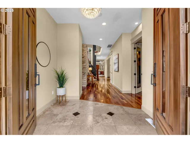 a view of an entryway with wooden floor