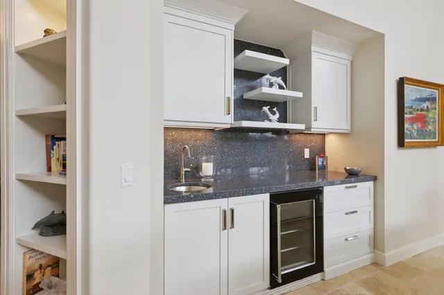 a kitchen with cabinets and window