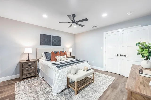 a bedroom with a bed and a couch