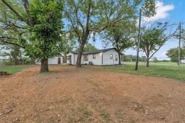 a house with trees in front of it